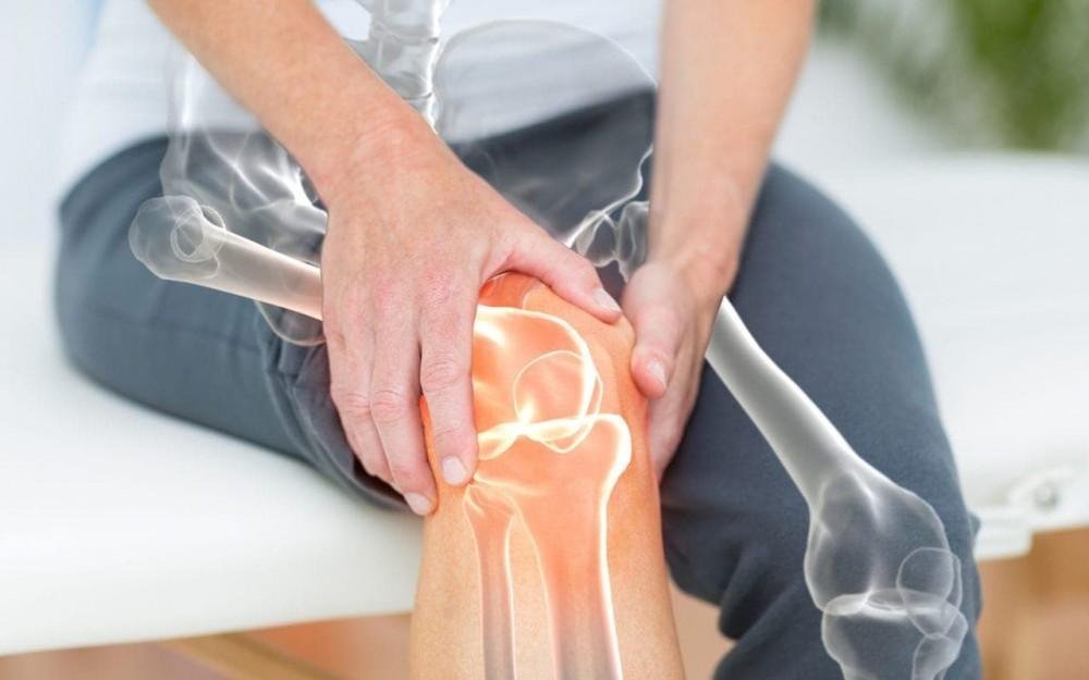 Man holding his knee due to joint pain