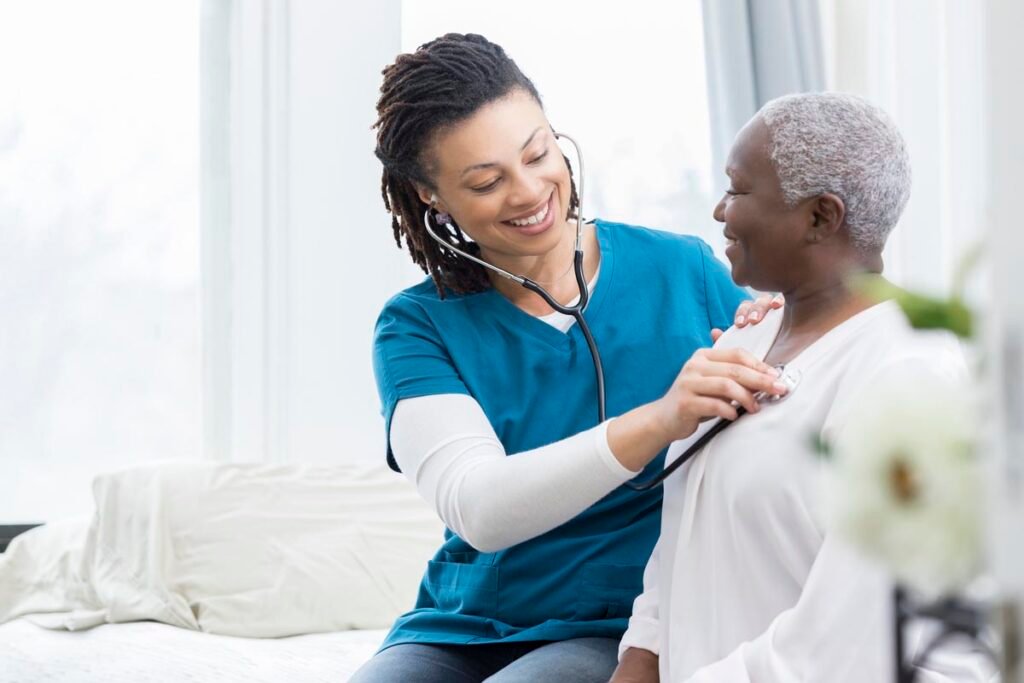 Nurse checking patient with stethoscope
