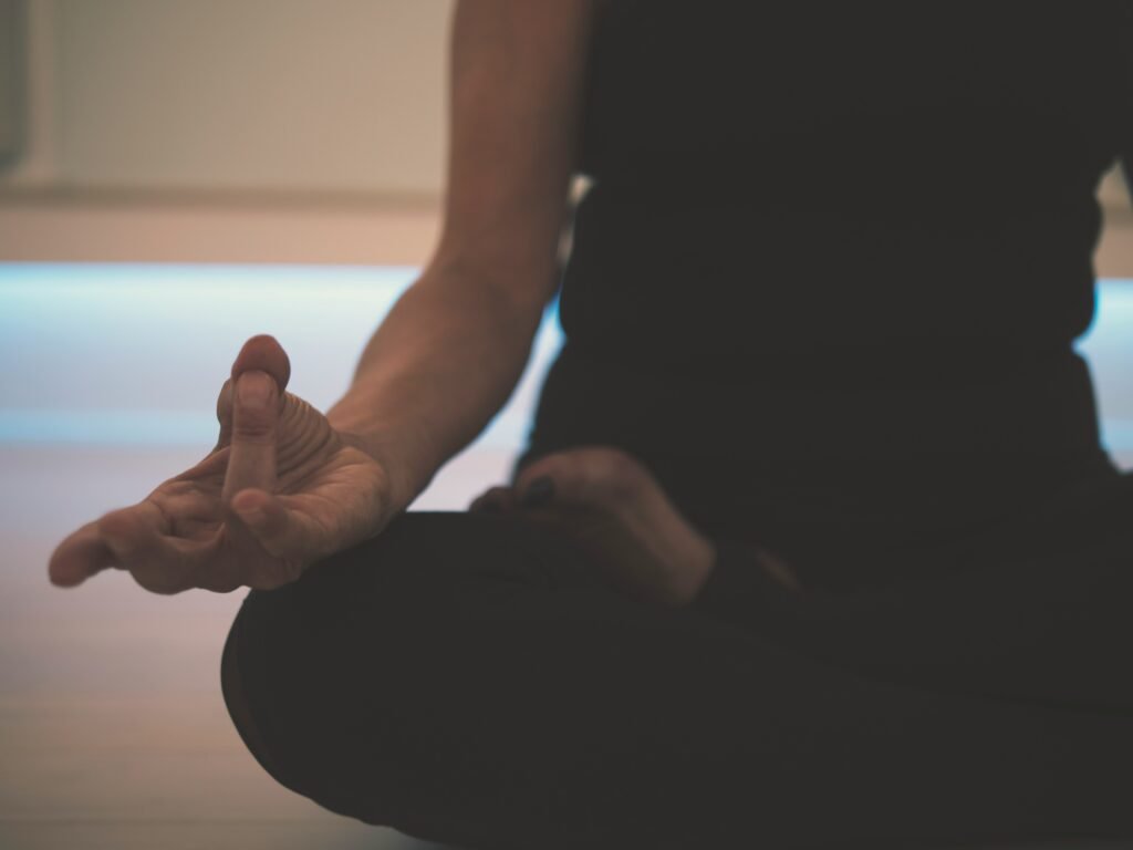 Person doing yoga on floor